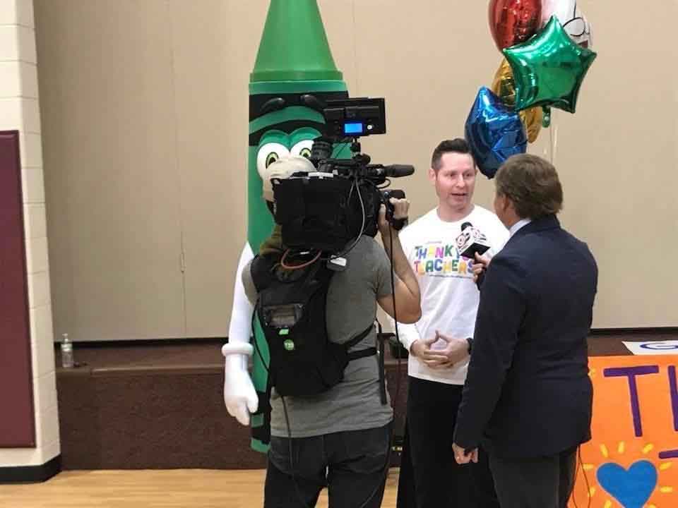 A photo of Andy DiOrio being interviewed.